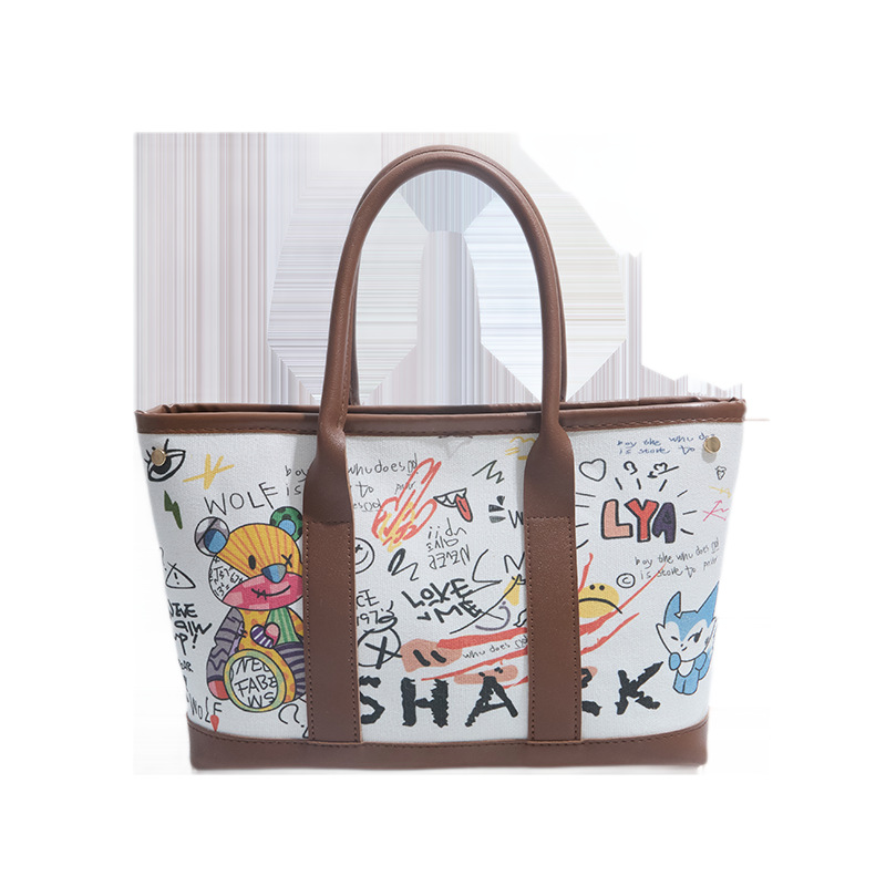 Invierno nuevo bolso de mujer personalidad graffiti portátil 2026 letras casuales Bear Tot bolso de cubo de hombro mochila