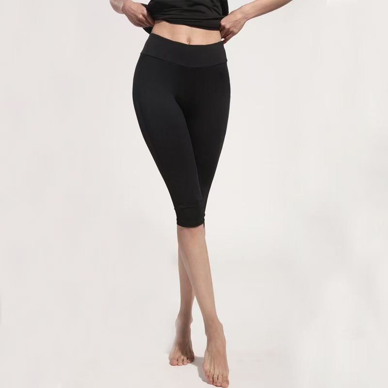 Primavera y verano yoga siete pantalones de malla de mujer empalmado hueco cintura alta pantalones deportivos para correr pantalones de ejercicio pantalones de bicicleta
