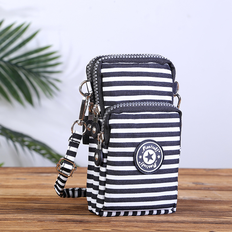 Suministro directo de fábrica BOLSA DE TELÉFONO MÓVIL bolsa de mensajero femenina bolsa de teléfono móvil de pantalla grande monedero bolso de la muñeca Halter corriendo vertical mini