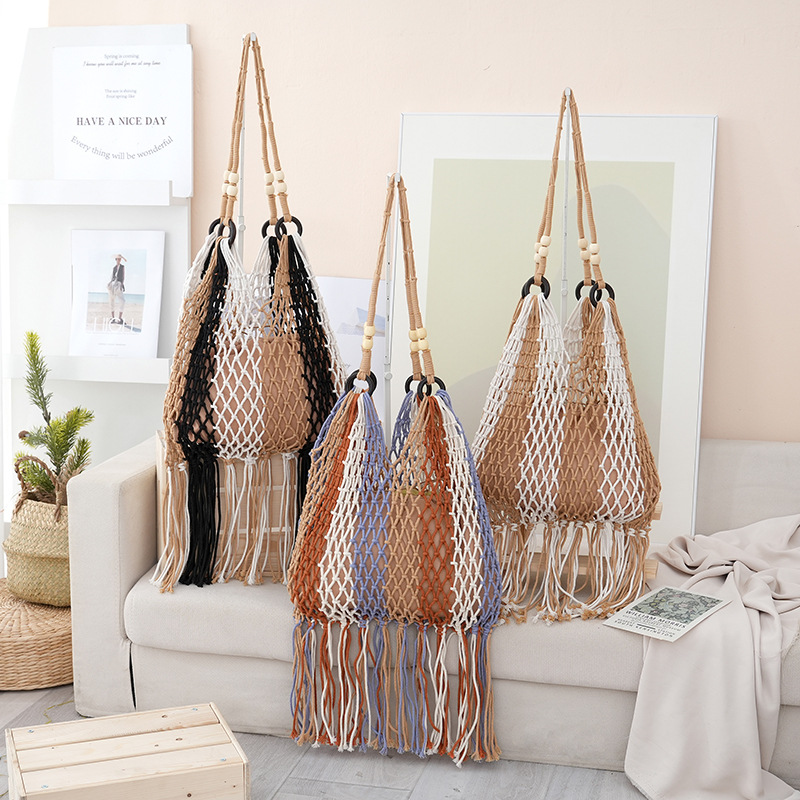 镂空编织包包女2025新款夏季通勤百搭单肩包大容量流苏网兜包手提