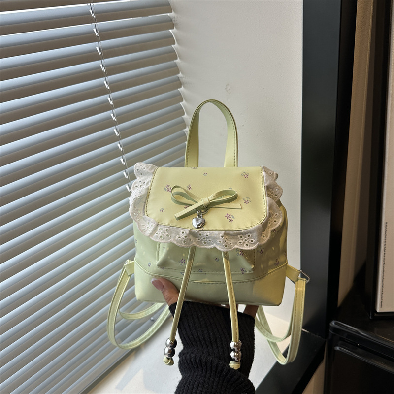 Mochila de flores para mujeres 2026 nueva moda alta sensación de mochila de estilo universitario ultra caliente de moda versátil mochila de viaje