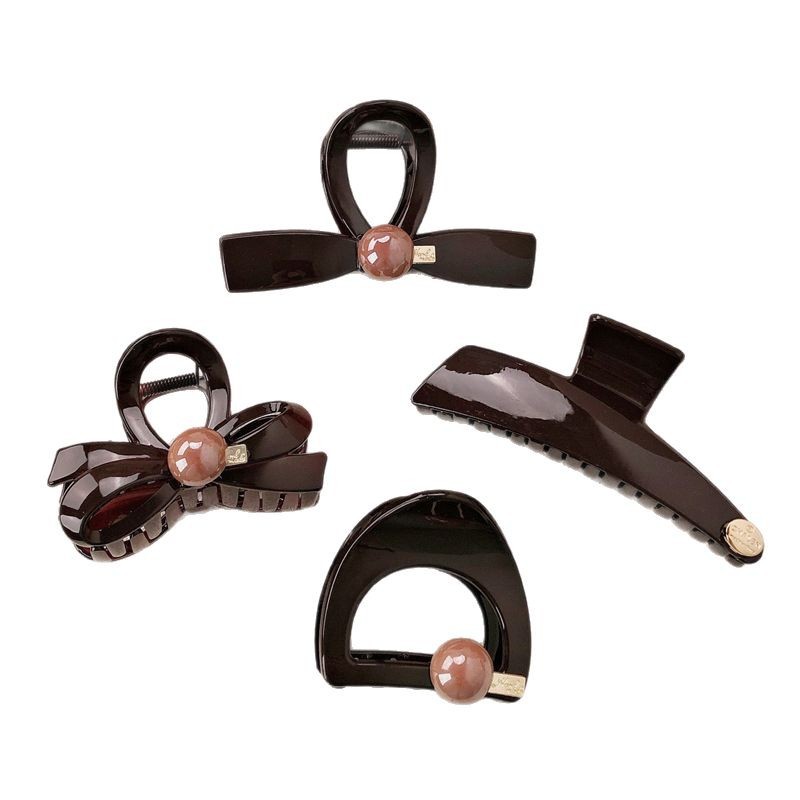 Diseño ~ principios de primavera de alta gama oro etiqueta clip de agarre para mujeres 2025 nuevo estilo de alta calidad clip de tiburón clip de cabello detrás de la cabeza