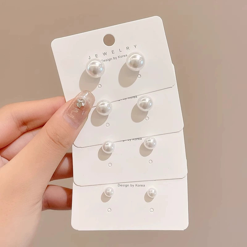 Pearl earrings, small elegant studs, light‑luxury minimalist style