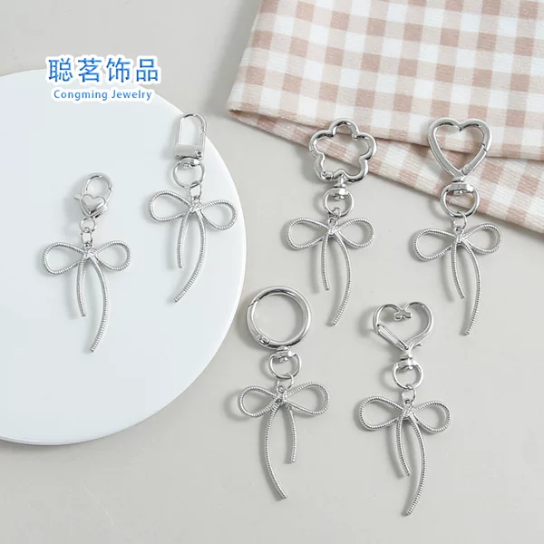 Creative Zinc Alloy Sweet and Cool Cut Out Bow Key Pendant Simple and Versatile School Bag DIY Pendant Accessories Wholesale