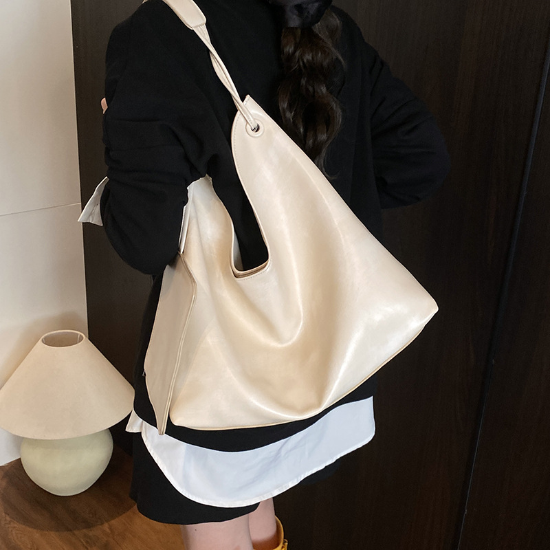 Nuevos productos transfronterizos más vendidos Bolso de cuero suave para axilas para mujer 2025 Modelo súper caliente Bolso de hombro de gran capacidad de viento perezoso