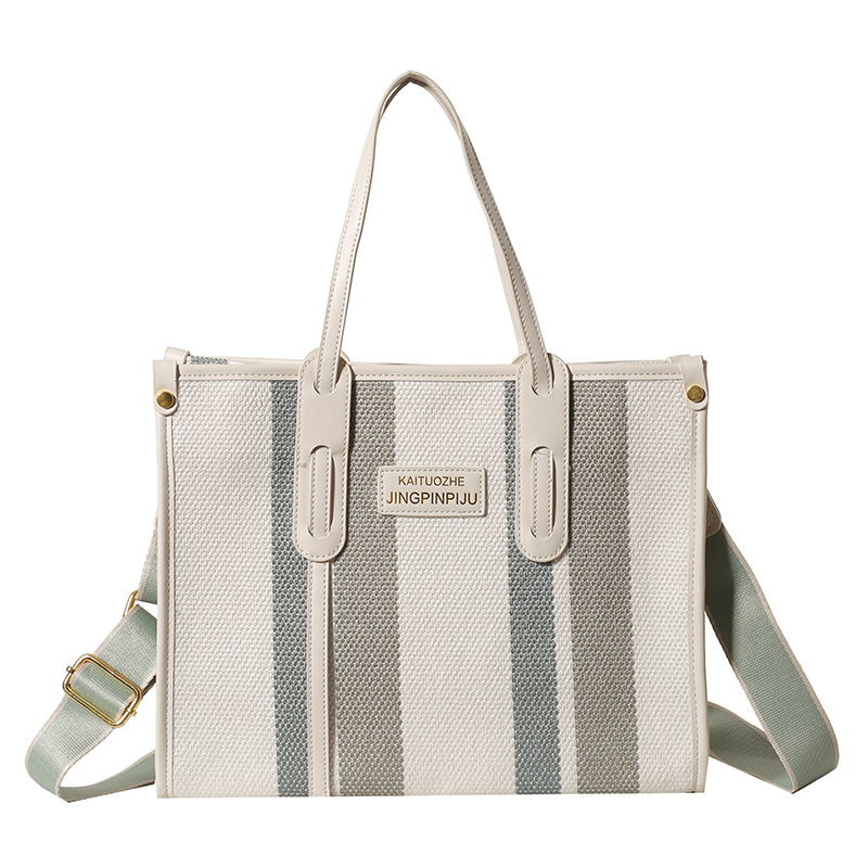 Bolso Tote portátil a rayas de color de contraste de lona para mujer 2024 nueva textura de moda transfronteriza bolso de mensajero de un solo hombro