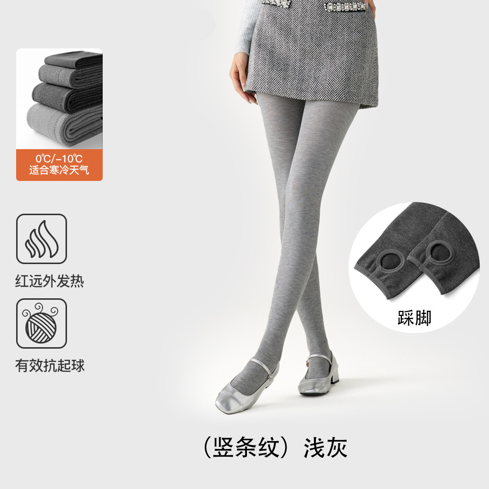 レギンスの靴下の女性は秋冬に厚い綿の縦縞のカシミヤの圧力を加えます。