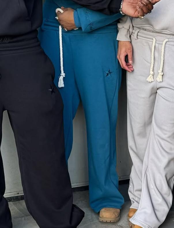 Spot europeo y americano pesado otoño e invierno 2025 principios de primavera doble cintura falso dos pantalones sueltos con cordón pantalones bordados al por mayor