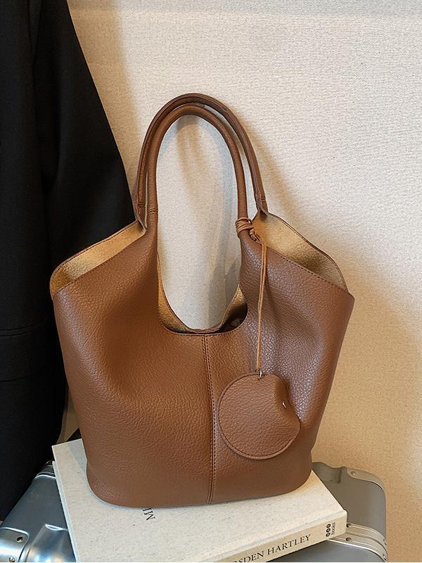 Bolso de cubo de axila de estilo explosivo transfronterizo para mujer 2025 nuevo bolso de hombro de cuero suave de viajero salvaje simple bolso de niño y madre de todo fósforo