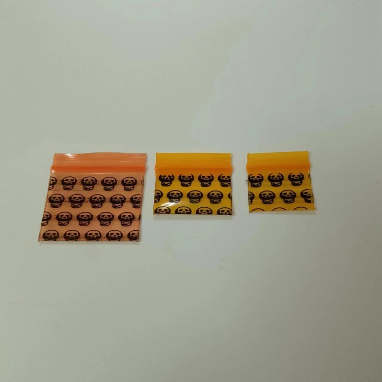 现货加厚小号自封袋印花橙色商品袋密封口袋药袋一元硬币大小