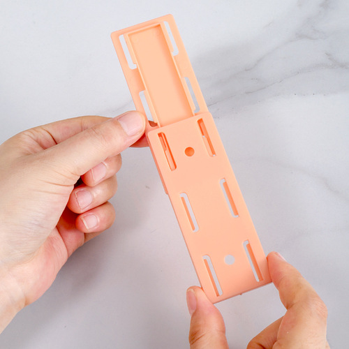 Plug holder wall-mounted socket plug-in row storage rack free of punching wall hanging household wall-mounted wire storage