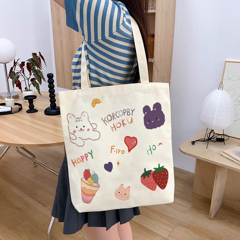 Original cartoon canvas bag for women, 2026 new model, student tutoring bag, large capacity shoulder bag, handbag, available for dropshipping Original cartoon canvas bag for women, 2026 new model, student tutoring bag, large capacity shoulder bag, handbag, available for dropshipping