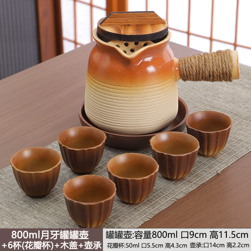 Tetera en una estufa, tarros de té con leche a la parrilla, ollas especiales, utensilios de cerámica de cocción en seco para el hogar, juego completo de juegos de té