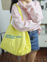 大容量字母帆布包女2024新款小众单肩包学生通勤包休闲百搭托特包