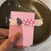 Coffee dog with pink clothes and white polka dots
