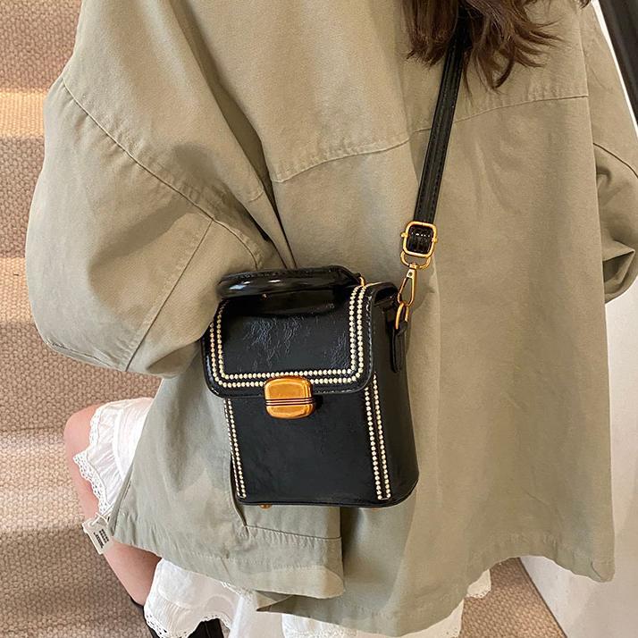 Retro versátil bolso de mano para mujeres 2025 nuevo nicho de alto nivel sensación de hombro mochila de moda bolso móvil