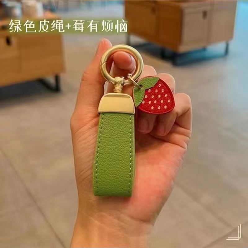 Estilo francés de alta gama de cuero fresco cuerda coche llavero simple lindo clave colgante Pequeño Libro Rojo mismo estilo girasol