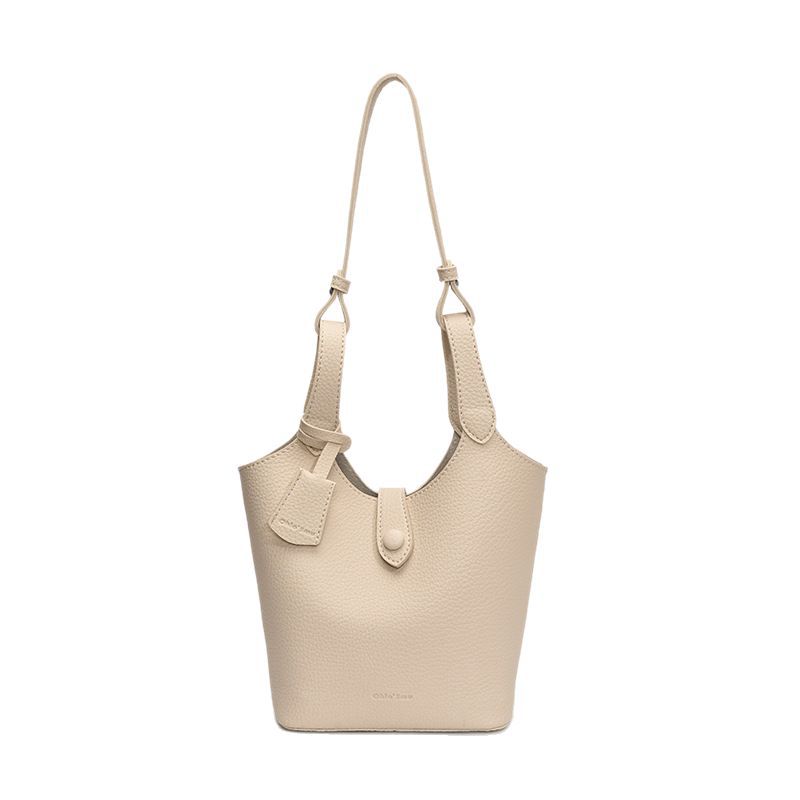 Moda coreana de gran capacidad bolsas de cubo de mano mujeres 2025 primavera y verano nueva canasta de lichi mochila de hombro