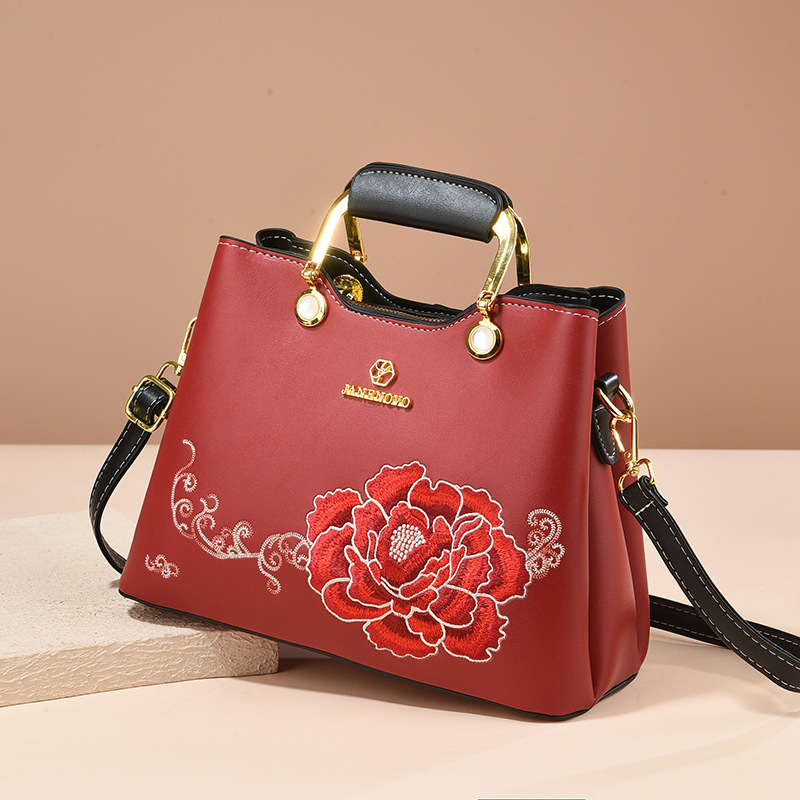 Regalo de temperamento de nicho para mamá 2025 nuevo estilo para suegra y ancianos bolso de hombro bordado elegante y de moda