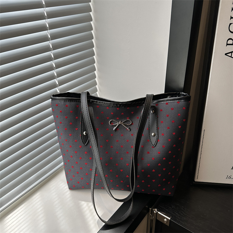 Bolsa de tela de gran capacidad de aire extranjero, punto de onda de corazón de桃ar, otoño de 2024 nueva moda de moda, bolsa de hombro universal