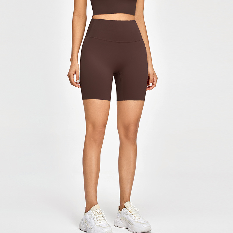 Nude Lycra apretados pantalones cortos de fitness ropa de yoga desnuda de mujer Cintura alta Peach Hip lifting pantalones cortos de yoga deportivos de secado rápido