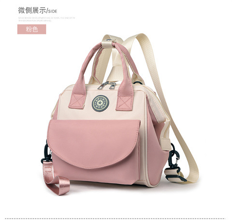 The Mommy bag is small and cute. It has a detachable front pocket and is a multi-functional baby bag. It is waterproof, lightweight, and has a crossbody design. It can be used to carry milk bags undefined