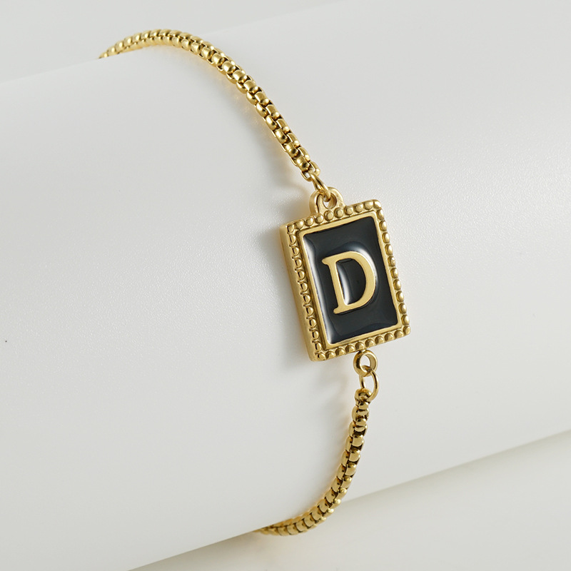 La moda europea y americana transfronteriza del acero inoxidable 26 pulsera inglesa de la letra en relieve pulsera Titanium de la cremallera del acero 18K de la frontera para las mujeres