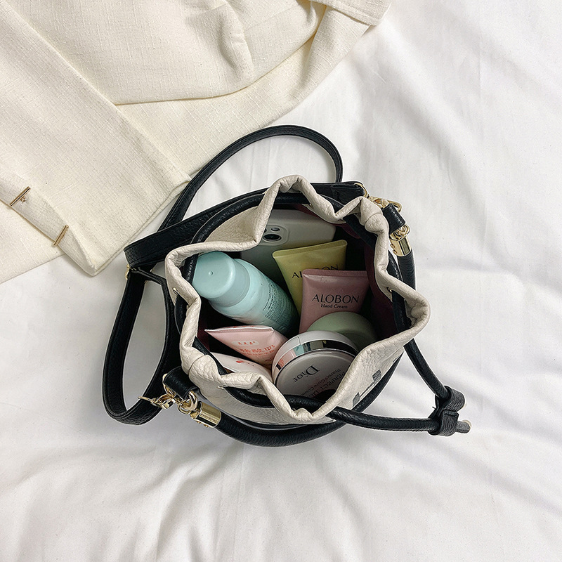 Bolso de hombro femenino casual todo-fósforo diseño de nicho sentido contraste color costuras cubo bolso de mano moda tendencia bandolera