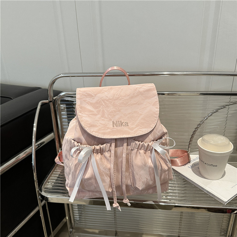Mochila de lazo de sentido de alta gama para mujer 2025 nueva moda mochila de viaje mochila escolar casual para estudiantes coreanos