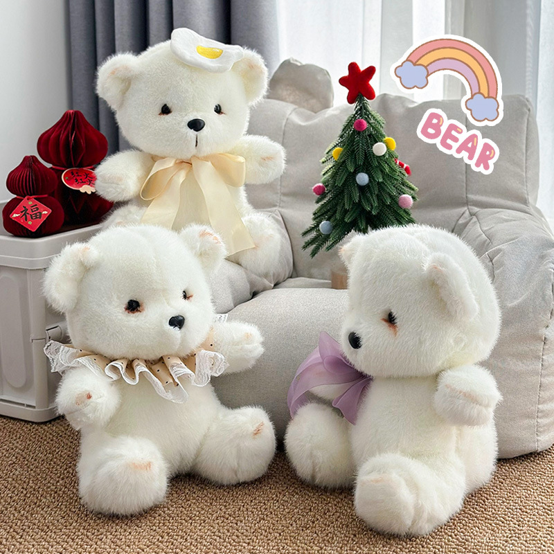 Nuevo pequeño oso blanco sentado muñeca arco de marioneta fumegante muñeca de oso juegos de video ciudad muñeca de peluche grande juguetes al por mayor