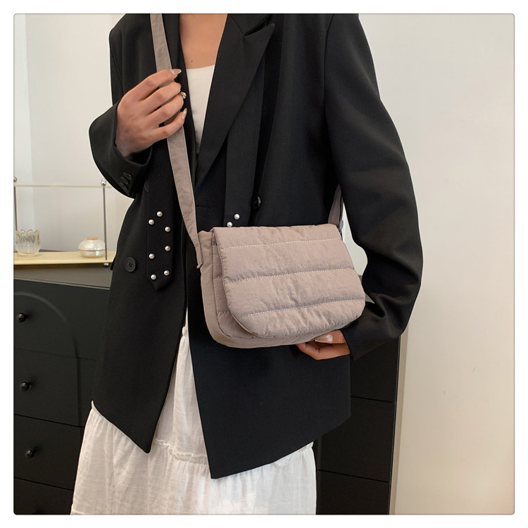 Daily casual simple small square bag Korean spring lightweight personality design popular shoulder crossbody horizontal small square bag_voghion.com