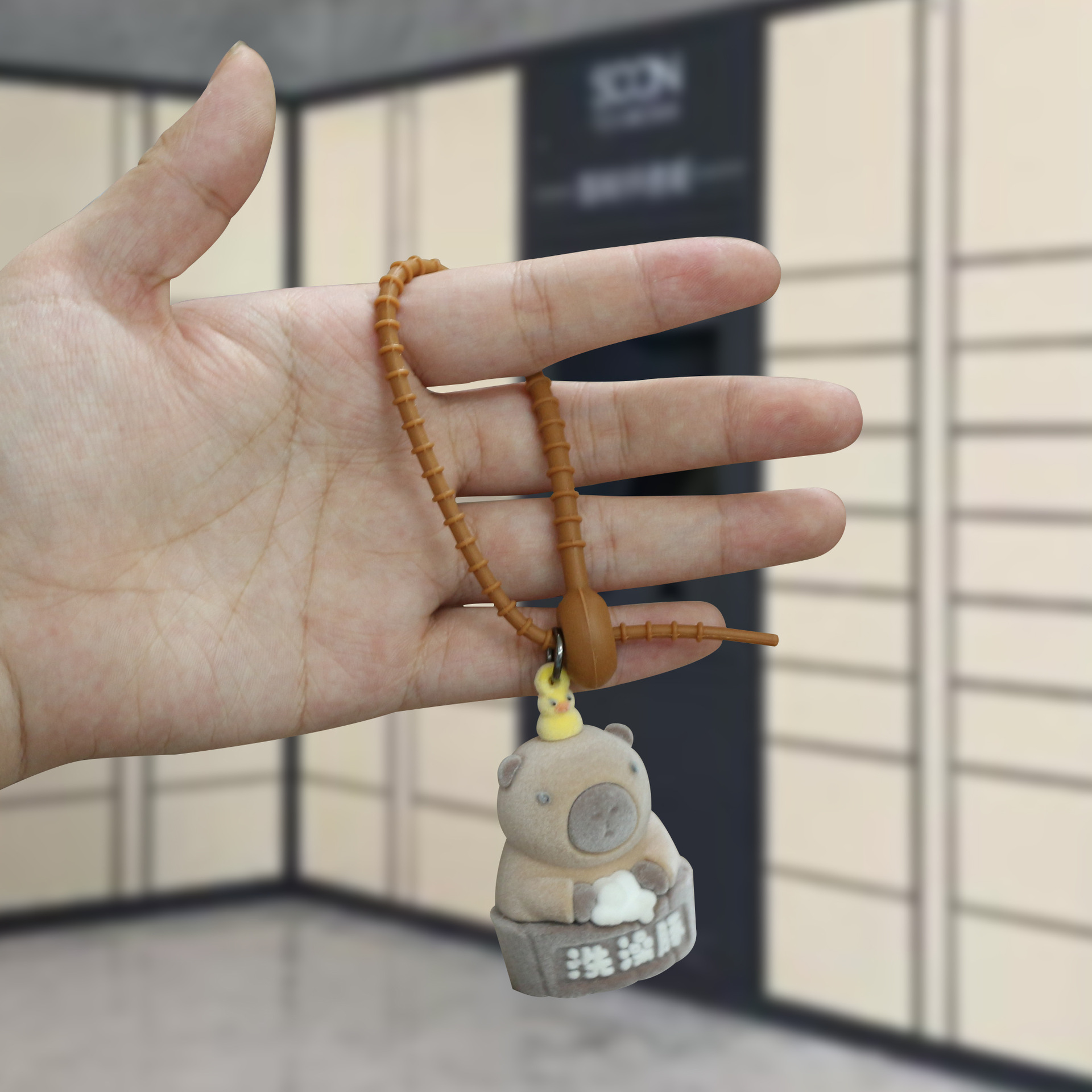 Explosiones transfronterizas flocado nutria llavero de caricatura tridimensional muñeca llavero colgante llavero de bolso