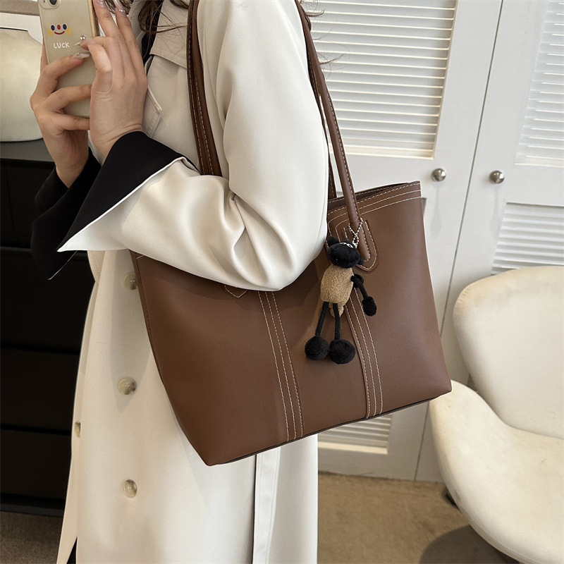 Bolsa de cubo de textura de alta capacidad de moda para mujeres de viaje 2024 otoño y invierno nuevo estilo universal coreano bolso de hombro