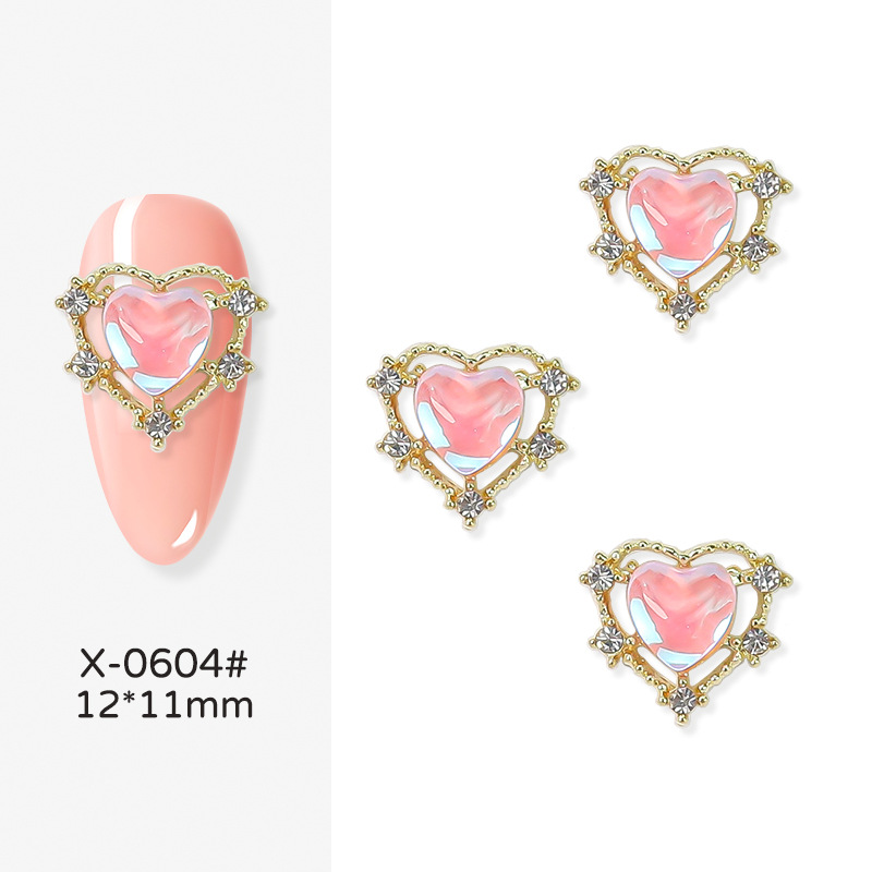 Nueva joyería de uñas Rojas netas Nueva Aurora en forma de corazón de diamantes de oro y plata Corazón de melocotón Diamante grande linda chica bonita yema de los dedos decoraciones