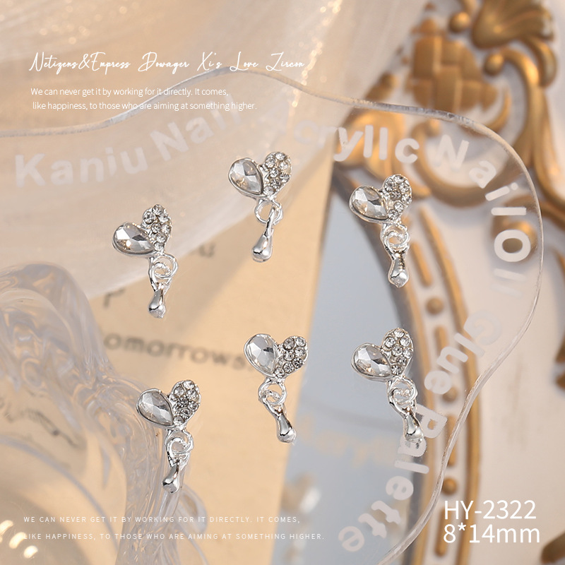 Nueva joyería de aleación de manicura completa diamante borla arco corona plata uñas manicura joyería accesorios al por mayor