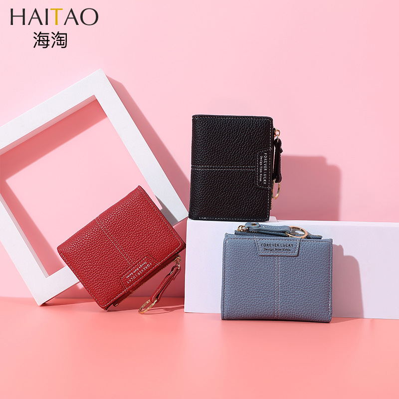 Cartera corta de mujer de color sólido de lujo ligero nicho Volkswagen gran capacidad dos carteras plegables cremallera mini bolso de cambio de mujer