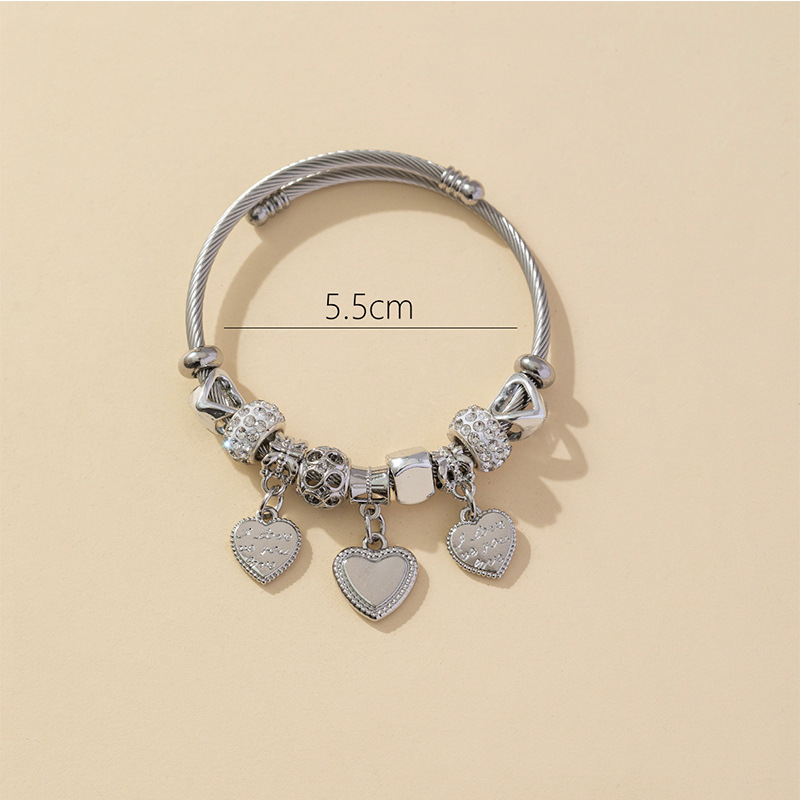 Panjia pulsera Dora DIY cuentas explosivas transfronterizas anillo de acero inoxidable bola de perforación aleación de letra en forma de corazón brazalete accesorios