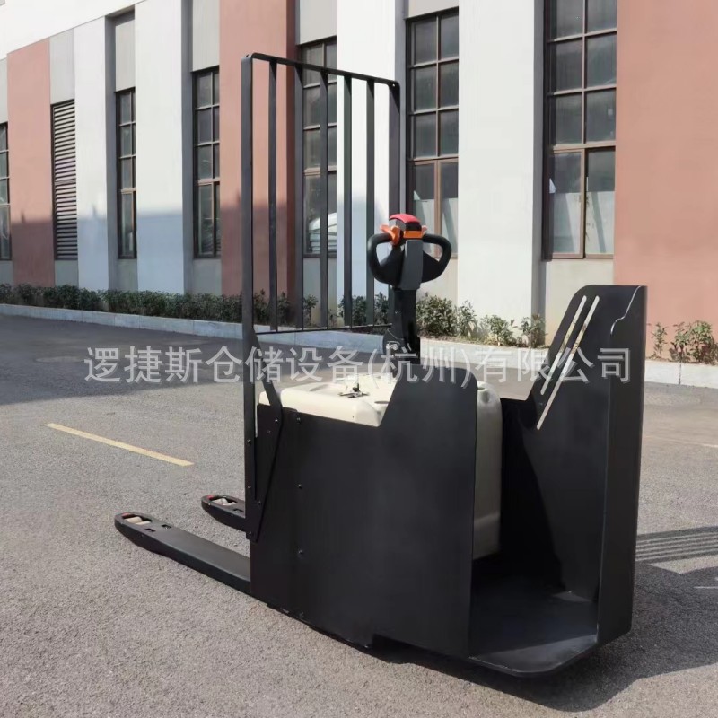托盘搬运车2吨电动非标站驾式半包围挡货架地牛液压装卸搬运叉车