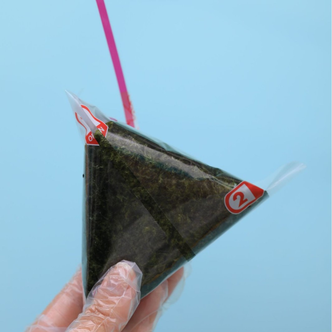 Fábrica directa de doble capa de bolsas de arroz triangular se puede calentar fácilmente desgarrar la bolsa de embalaje de sushi desechable de calidad de alimentos