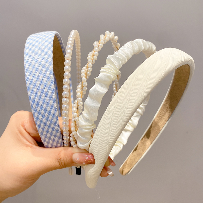 A principios de la primavera, la banda de cabello para mujeres en línea, 2025 nuevo lavado de cara de presión de tarjeta de cabello para el cabello, banda de cabello de perlas, banda de cabello para mujeres.