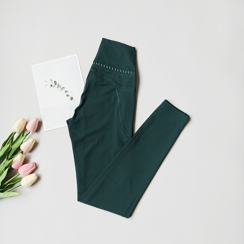 Pantalones de fitness desnudos para mujeres sonrientes líneas de elevación de cadera pantalones deportivos para mujeres al aire libre cintura alta sin marcas nueve puntos pantalones de calzado