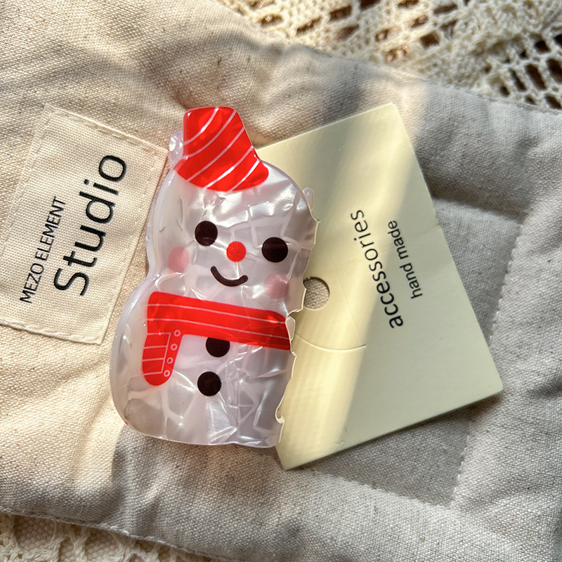 高級感アニメクリスマスかわいい雪だるまサンタクロースがレトロな髪を挟んで髪を結びます。|undefined