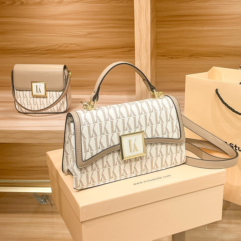 Hong Kong niche leisure leather square for crossbody versatile handheld one shoulder women's 2024 new small bag_voghion.com