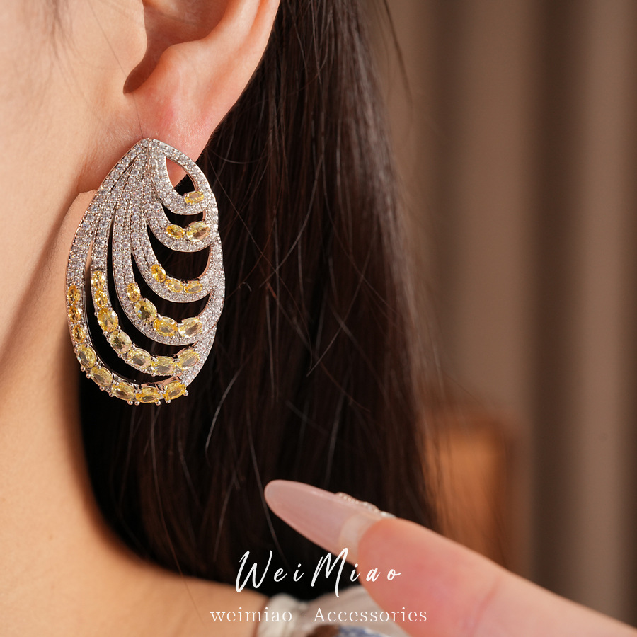 Aguja de plata zircon oval multicapa personalidad temperamento nicho pendientes de moda ligero lujo alta sensación auriculares al por mayor