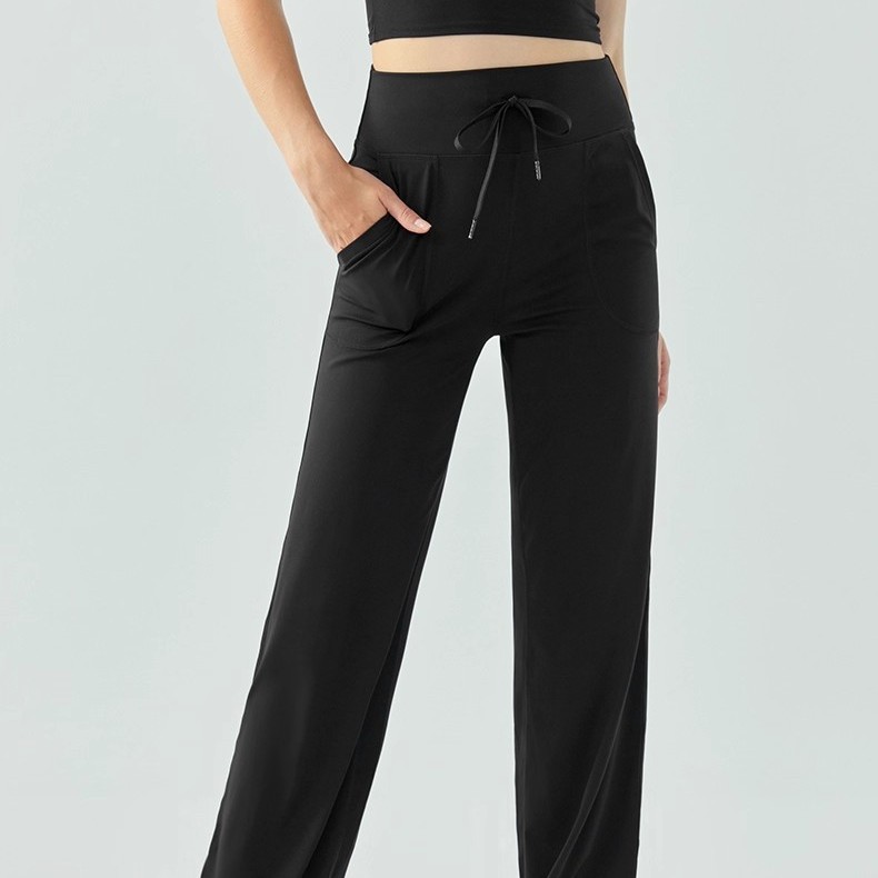 Pantalones deportivos de piernas largas desnudos sueltos respirables casuales pantalones deportivos de cintura alta, pantalones de calzado de calzado, pantalones de mujer