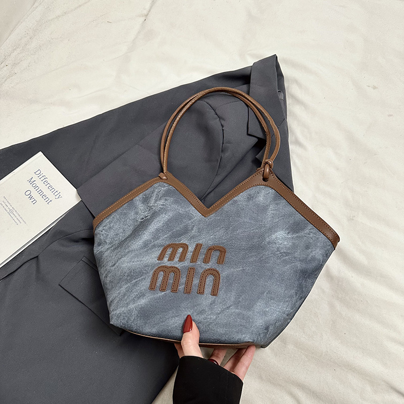 2024 nueva bolsa de gran capacidad para mujeres, bolso de hombro Sen Meng, bolso de diseño de nicho, bolso de viaje de alta calidad para mujeres