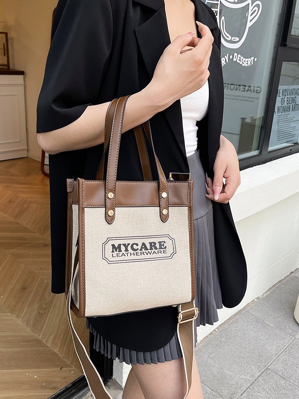 Bolso de mochila para mujeres 2025 nuevos productos transfronterizos de color de mano vertical tote de alta calidad bolsa de compras de transporte