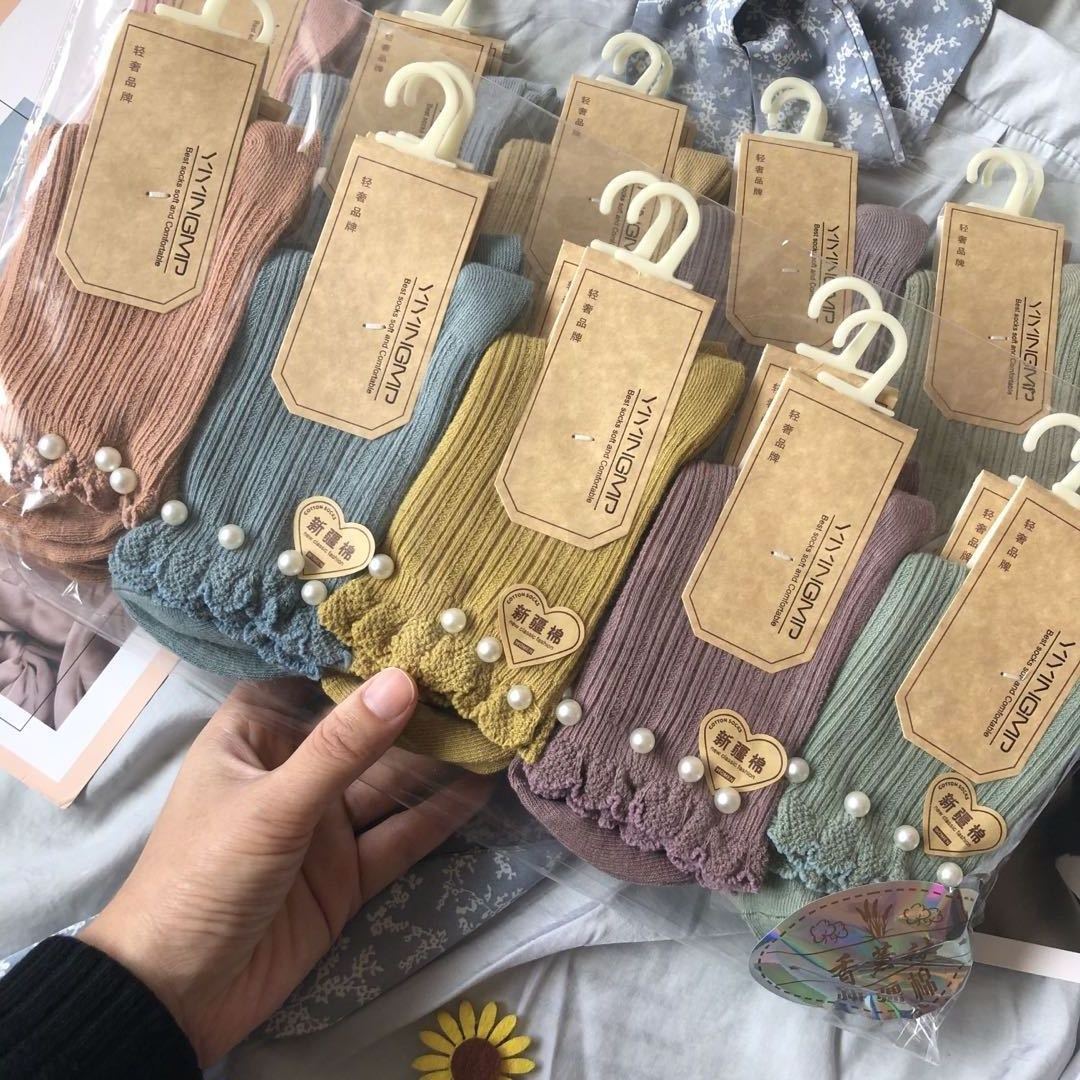 Cada par de Shangchao con gancho Otoño e Invierno nueva mujer de doble aguja de media pantorrilla calcetines de color caramelo lindas medias de encaje