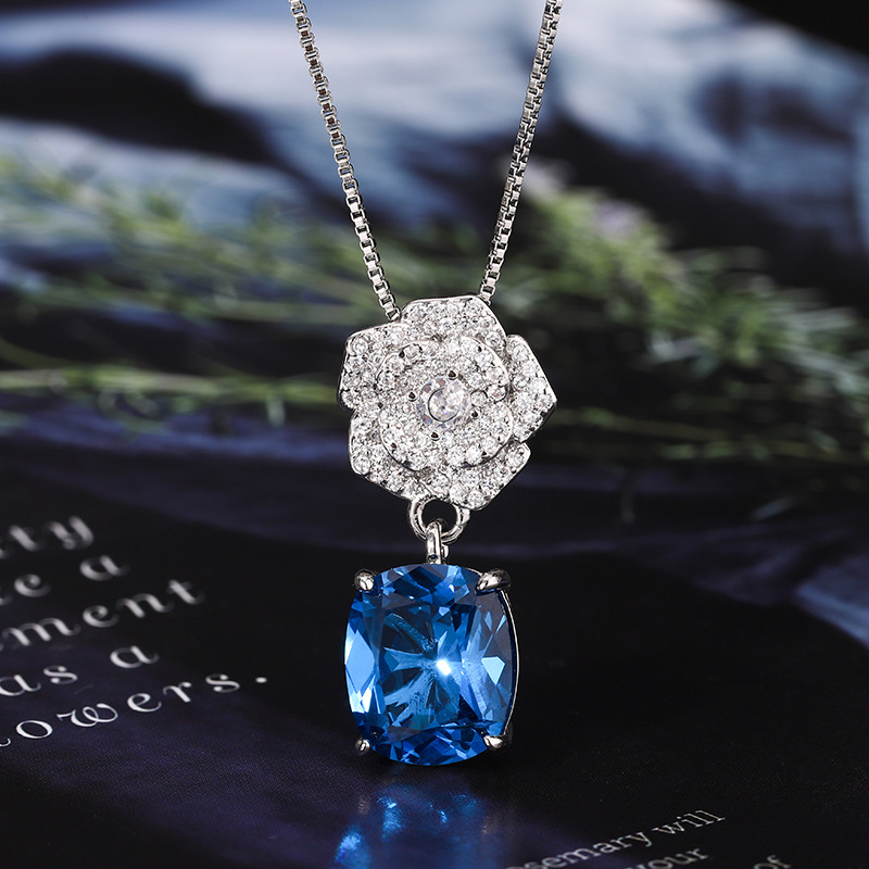 2024 nuevo estilo Zhuang Shengsheng joyería fondo de cobre chapado en oro simulación corindón temperamento retro juego de camelia 10*12