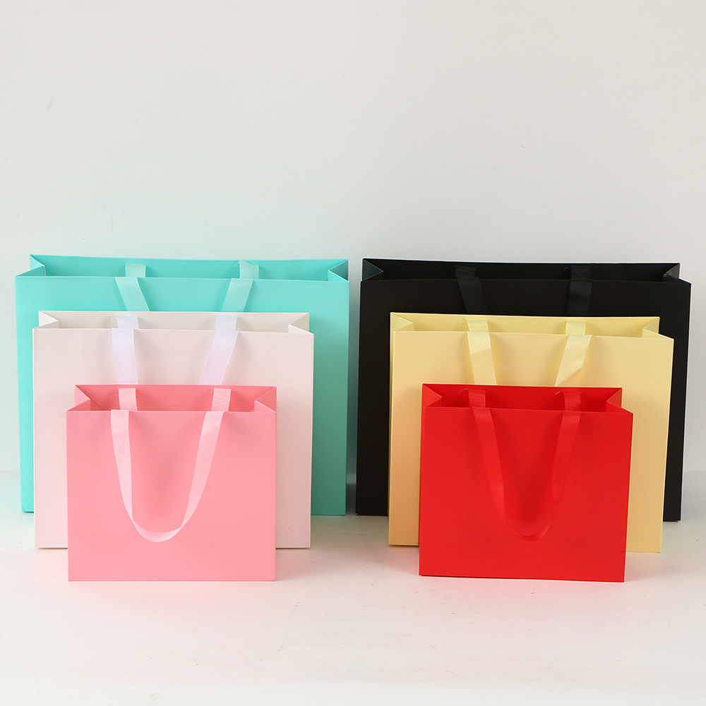 Caja plegable transfronteriza de una sola pieza Caja de regalo simple de fiesta Caja de embalaje de papel duro Caja de almacenamiento